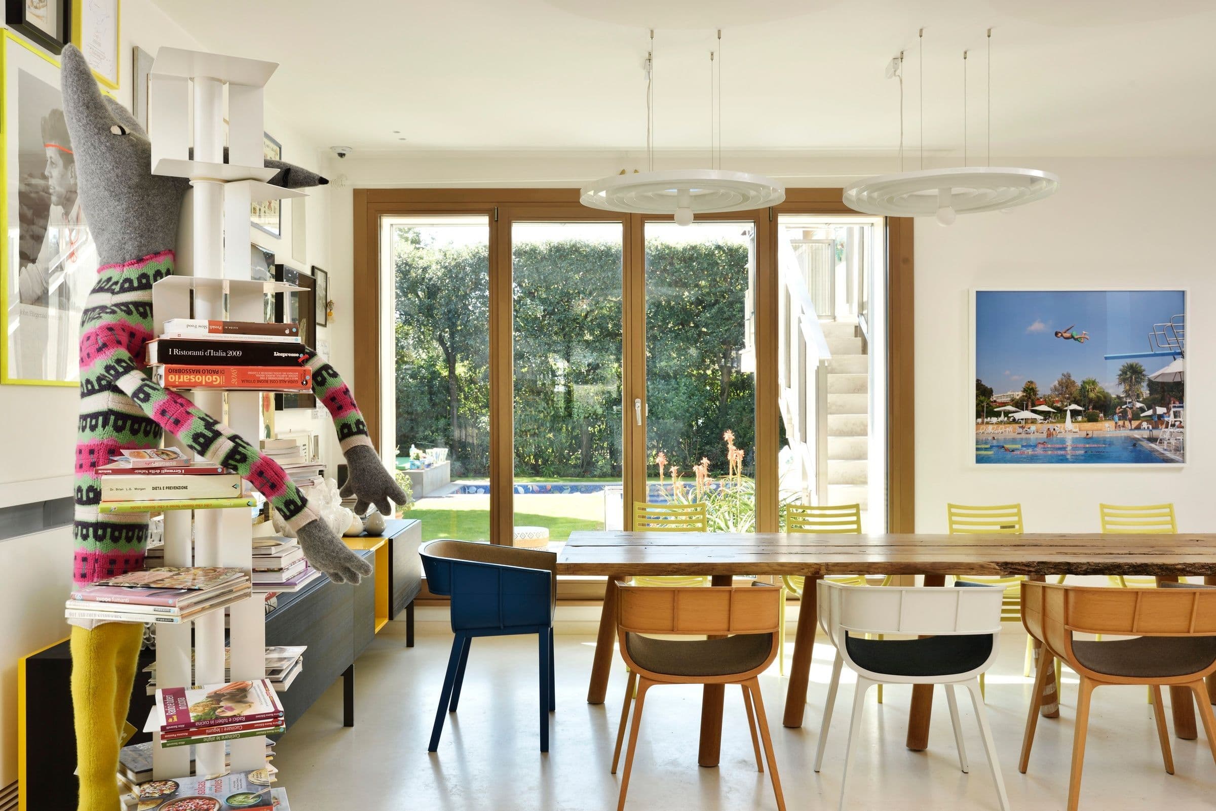 Villa Oblò indoor dining with live-edge table and art collection, Forte dei Marmi, Tuscany, Italy