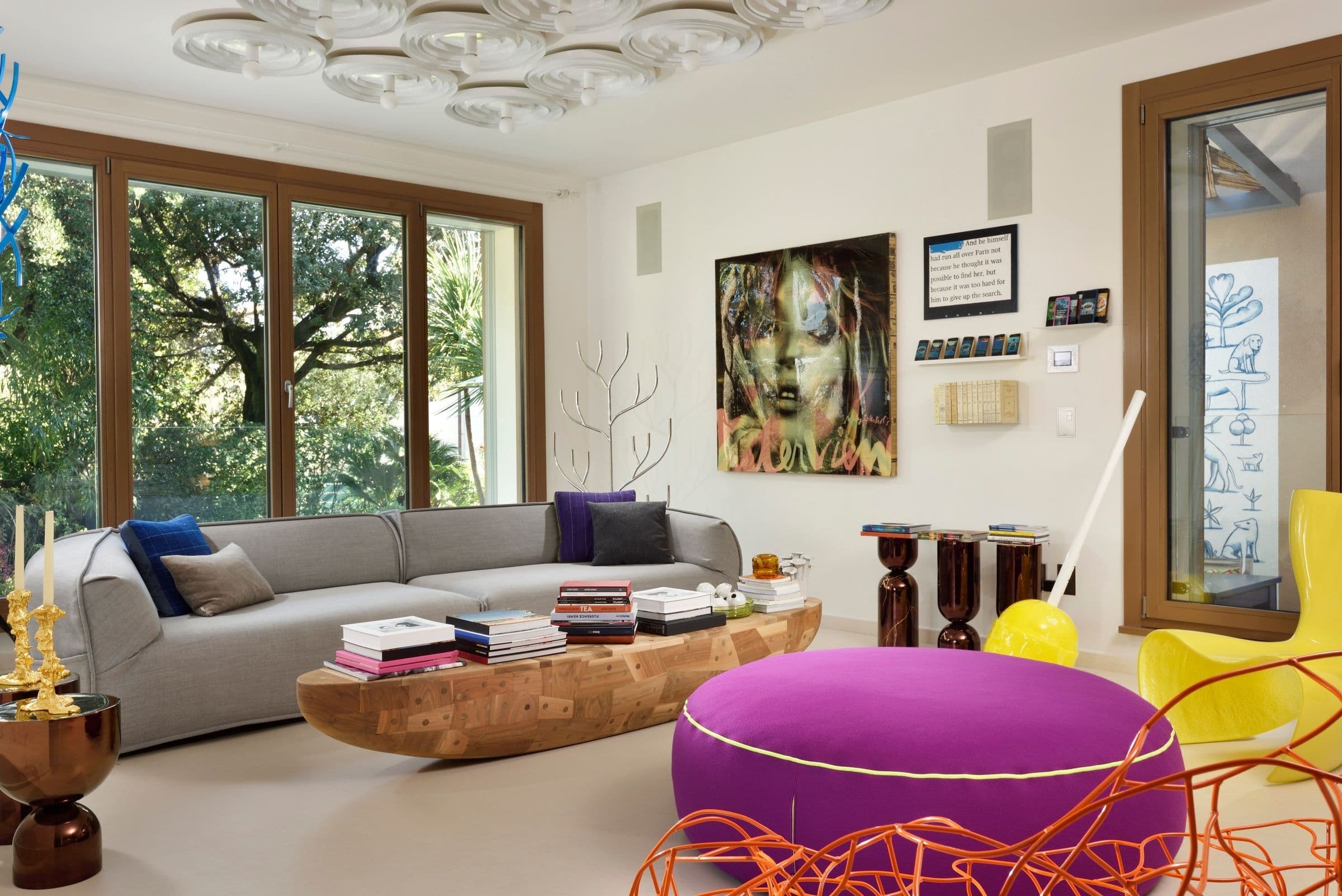 Villa Oblò living room with contemporary art and purple ottoman, Forte dei Marmi, Tuscany, Italy