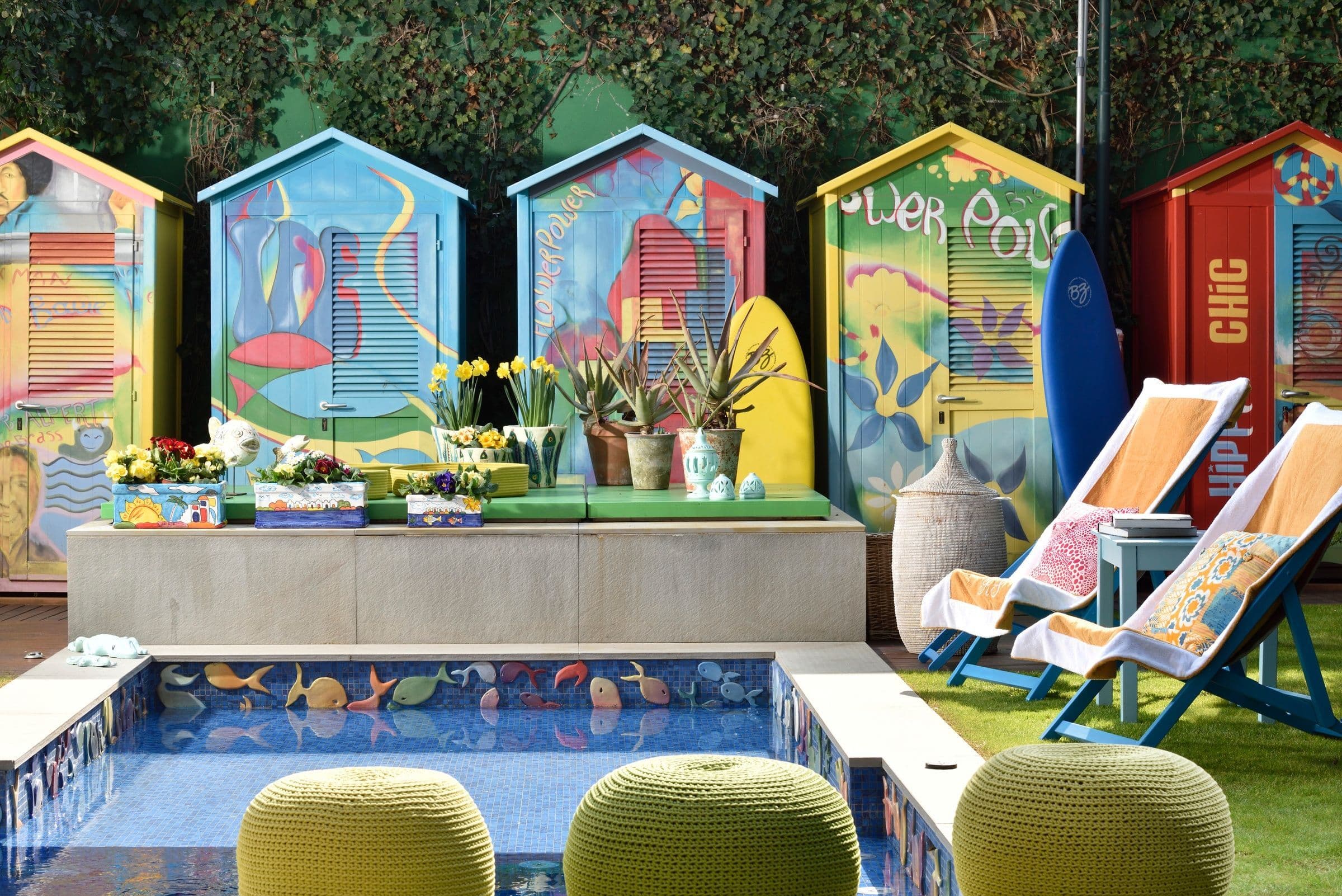 Villa Oblò pool deck with hand-painted cabanas and mosaic tiles, Forte dei Marmi, Tuscany, Italy