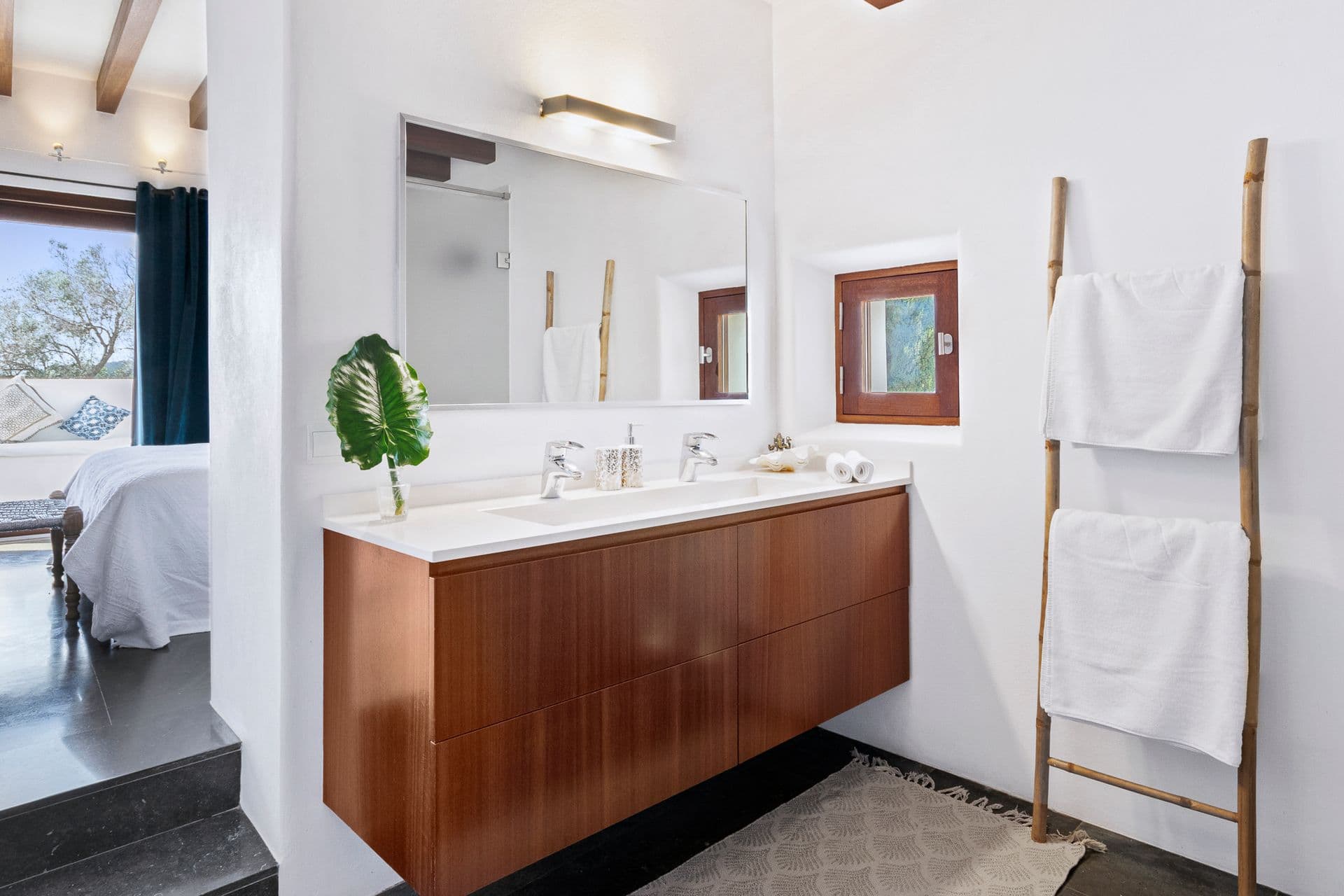 Bathroom with double wood vanity at Ode to Balearic Sunsets, Ibiza