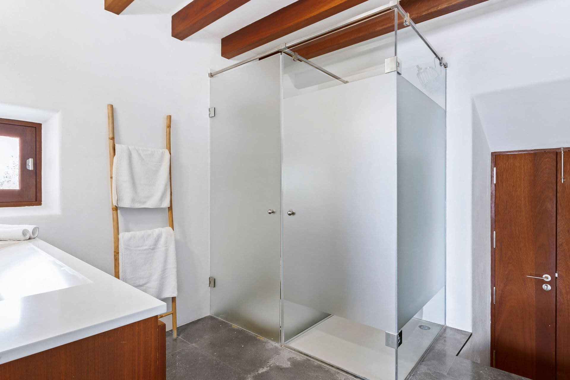 Bathroom with glass-walled shower at Ode to Balearic Sunsets, Ibiza