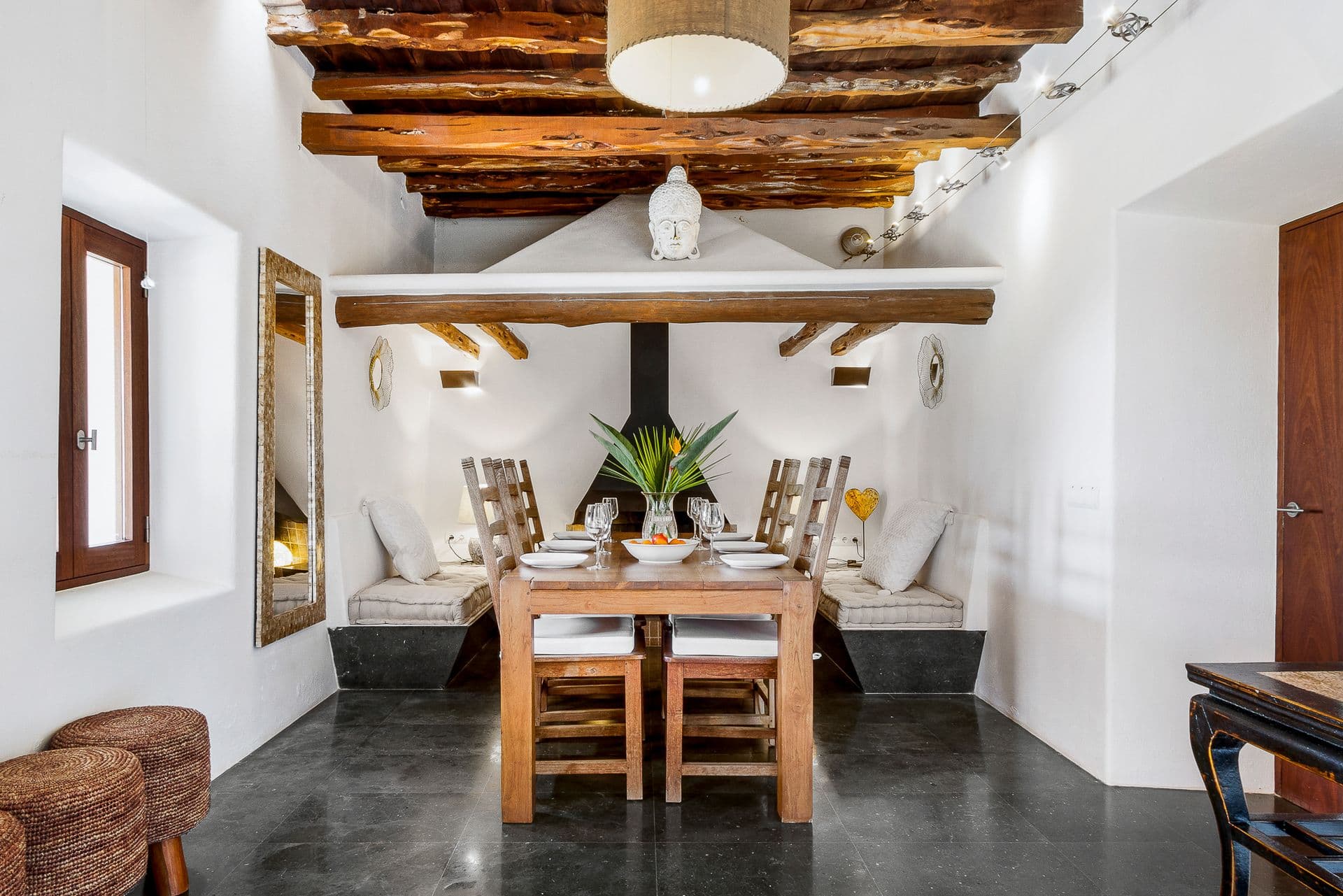 Indoor dining room with exposed wooden beams at Ode to Balearic Sunsets, Ibiza
