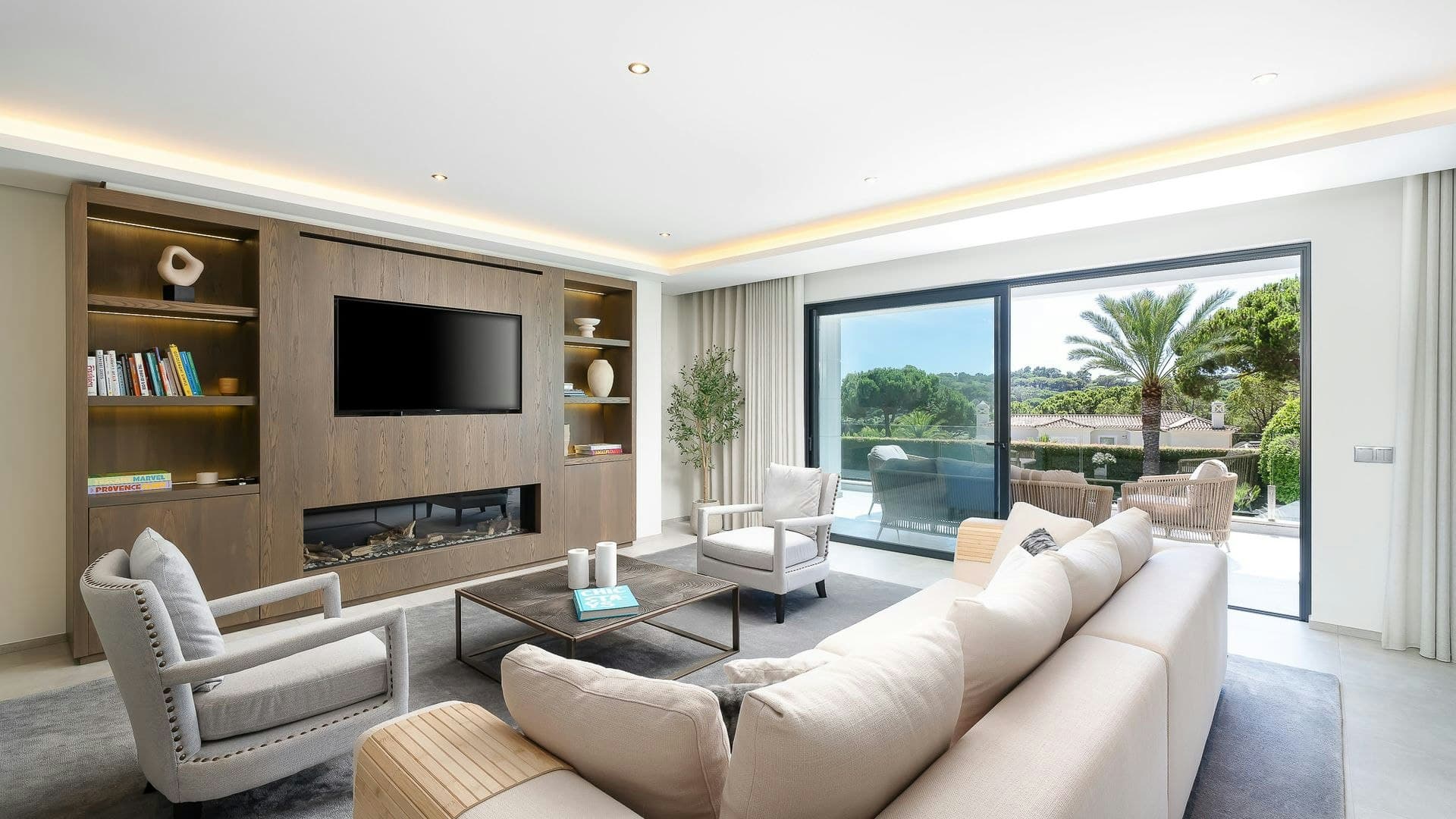 Sunshine Soul villa living room with fireplace and garden views, Almancil, Algarve, Portugal