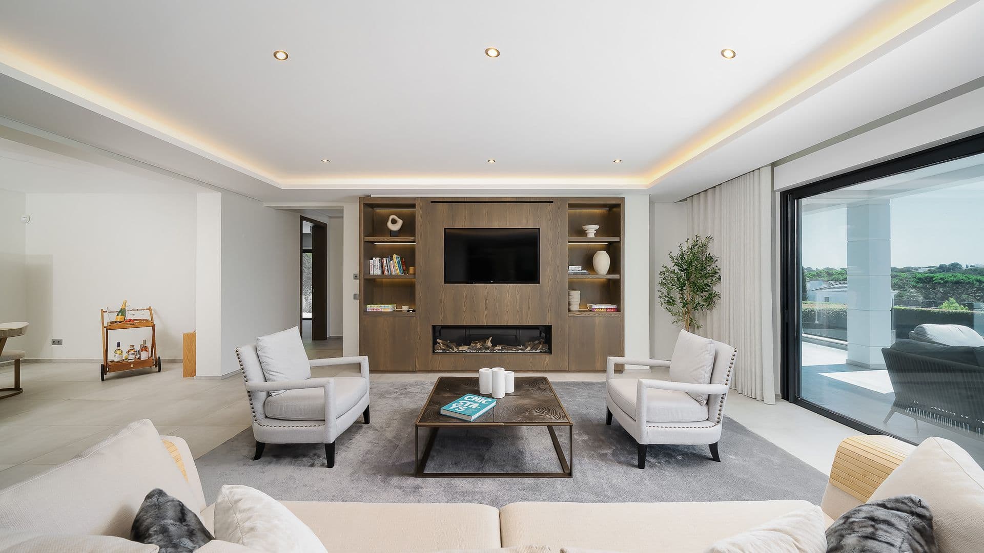 Living room with a built-in fireplace and wood media unit
