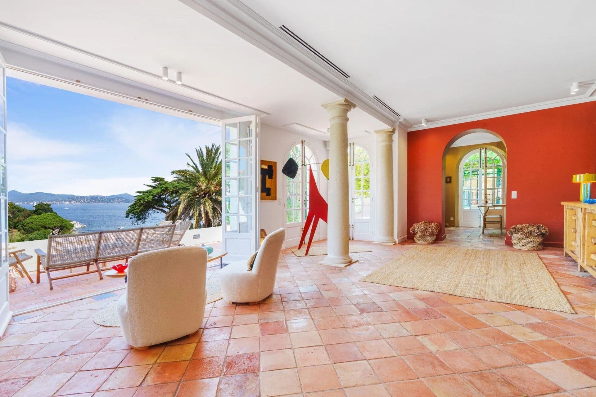 Terracotta-floored hallway with columns and a sea view at South Sea Bliss