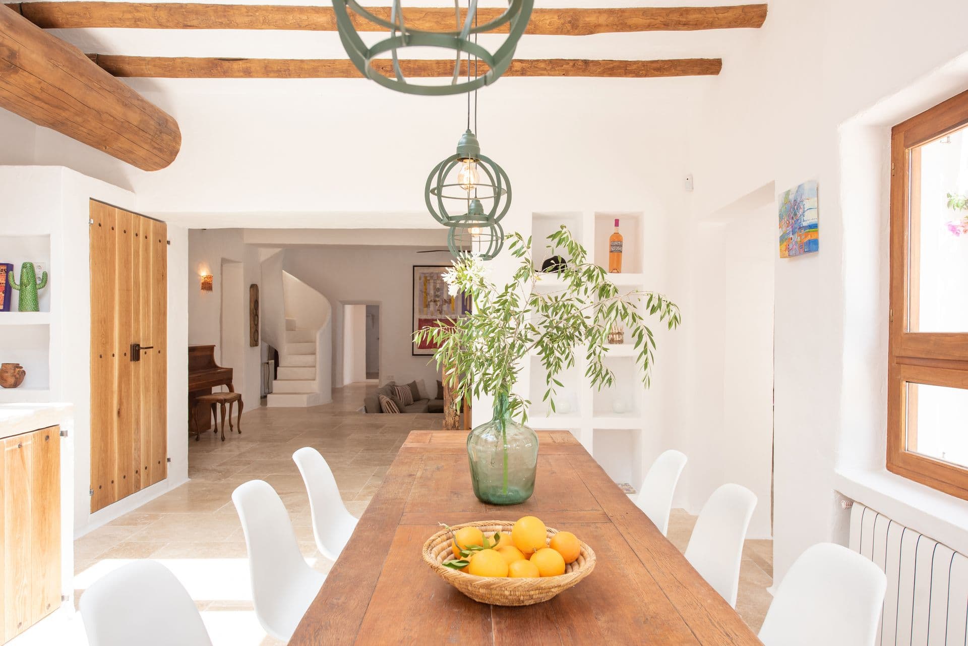 Dining room with a wooden table and exposed beamed ceiling
