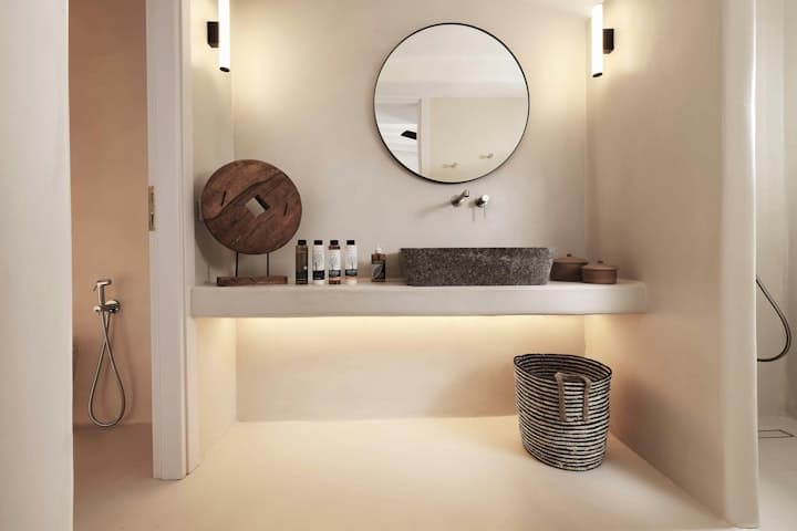 Sunshine Melody contemporary bathroom with stone basin and floating vanity, Mykonos, Greece