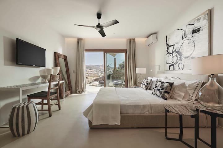 Sunshine Melody master bedroom with king bed and sea views, Mykonos, Greece