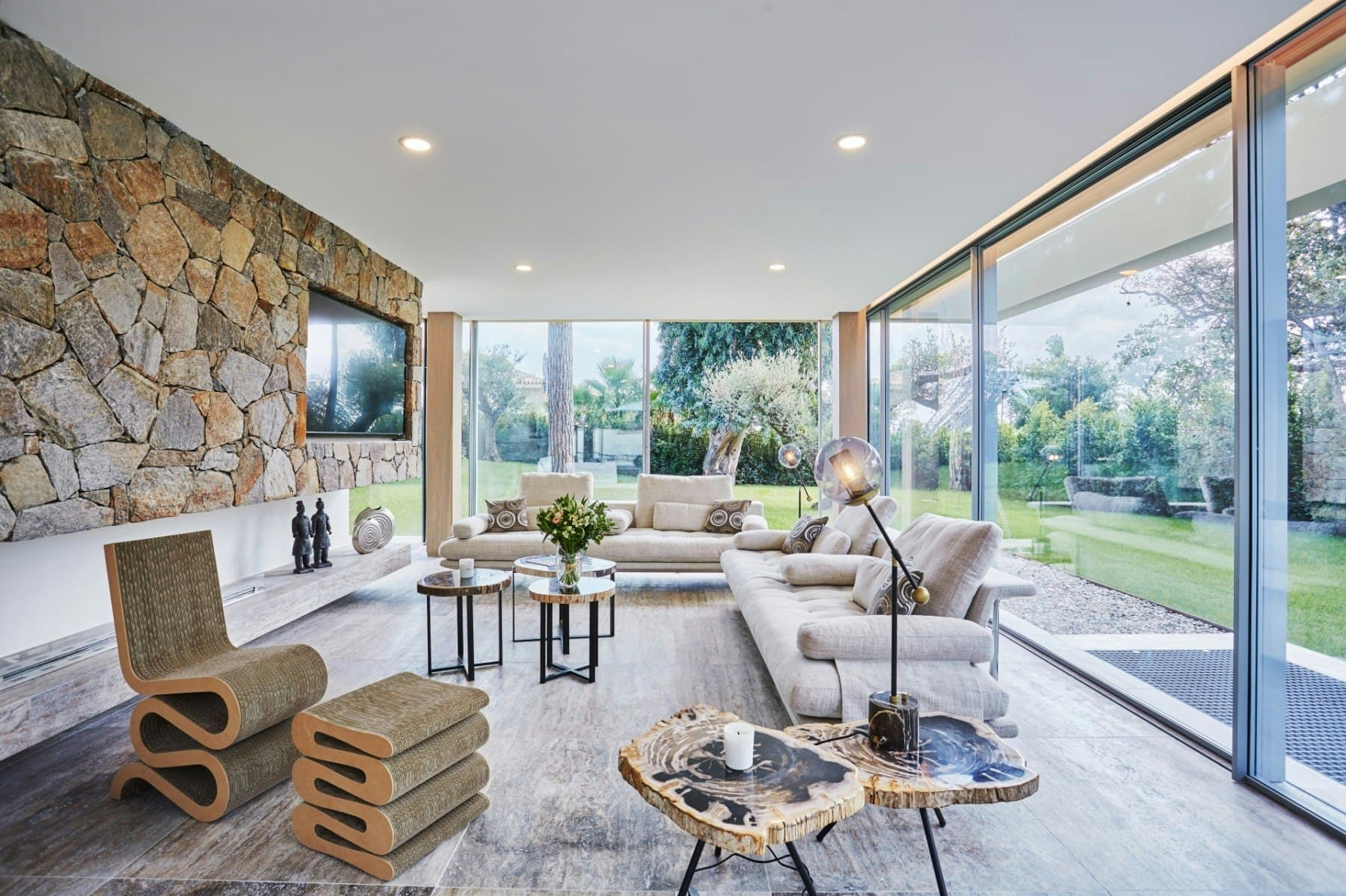 Saint Sunshine living room with stone walls and garden views, Saint-Tropez, French Riviera, France