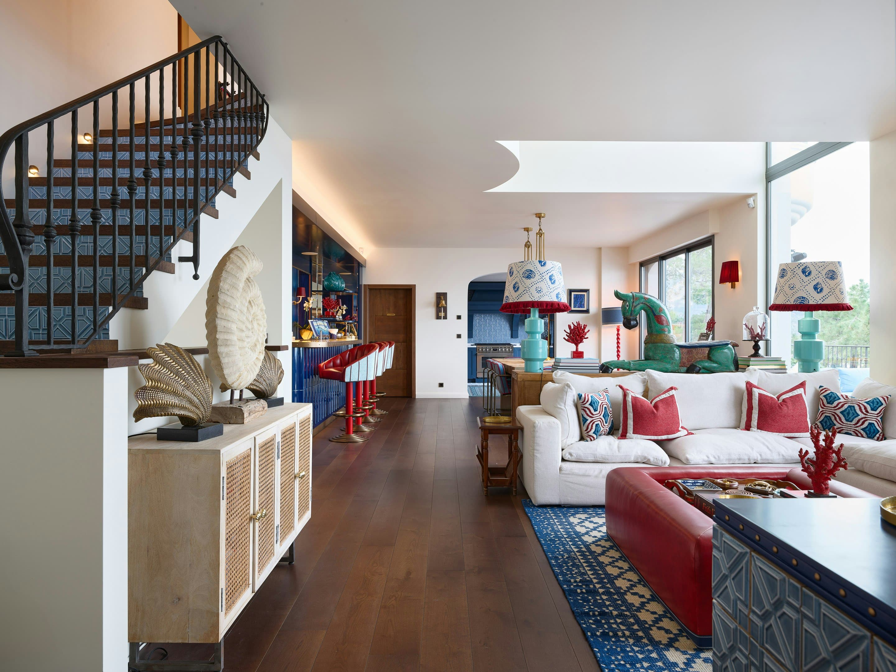The Riviera Charm living room with spiral staircase and eclectic decor, Théoule-sur-Mer, France