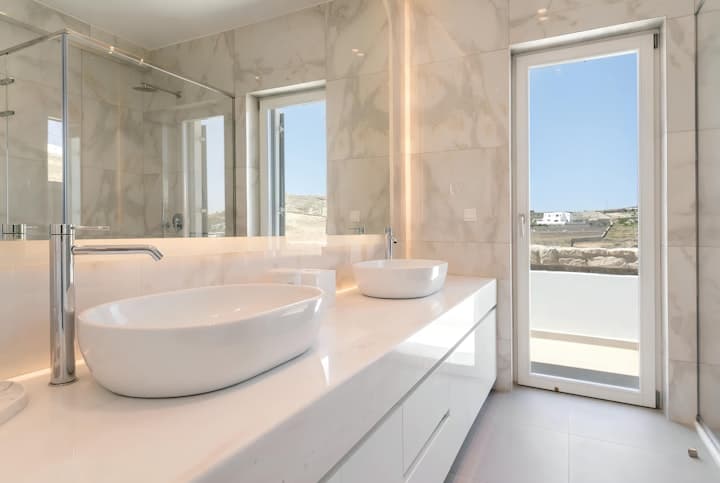 My Aegean Gem master bathroom with marble and twin sinks, Ornos, Cyclades Islands, Greece