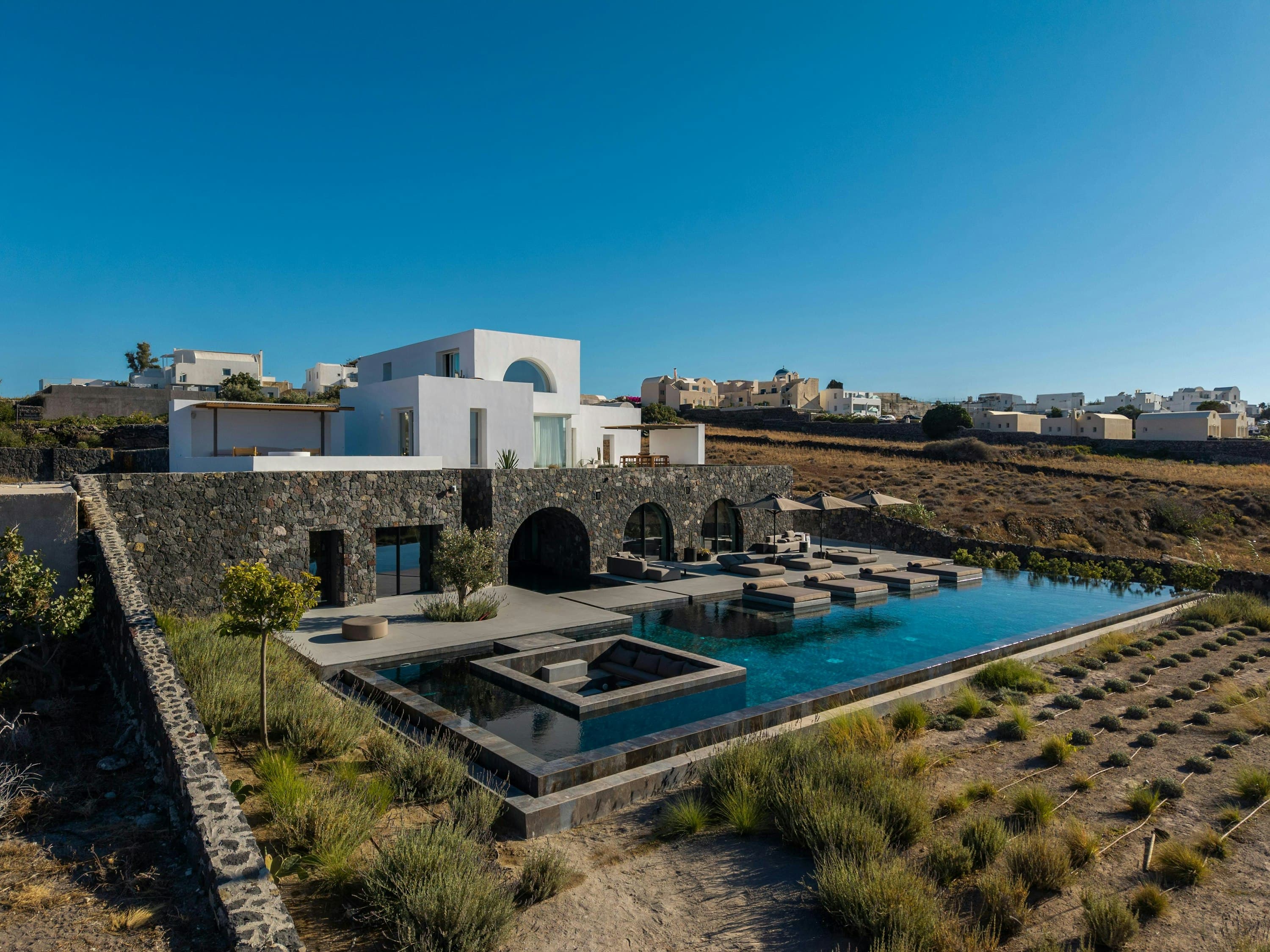 Earth Haven luxury villa with terraced infinity pool overlooking the Aegean Sea, Oia, Cyclades Islands, Greece