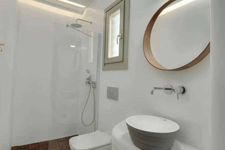 Seashore Silhouette ensuite bathroom with vessel sink and rainfall shower, Mykonos, Greece