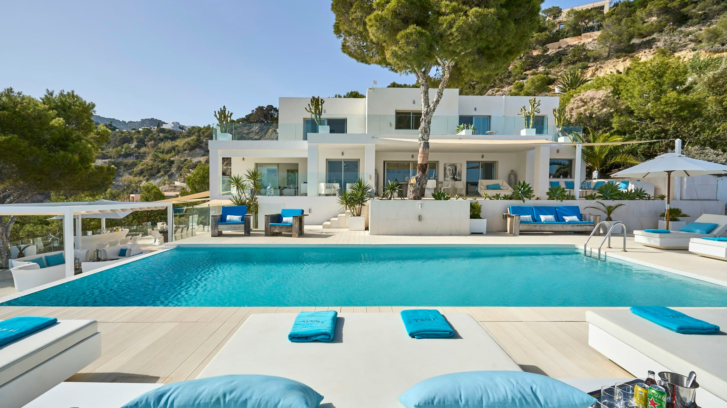 Tranquillity Glow villa exterior with infinity pool and terraces, Es Cubells, Balearic Islands, Spain
