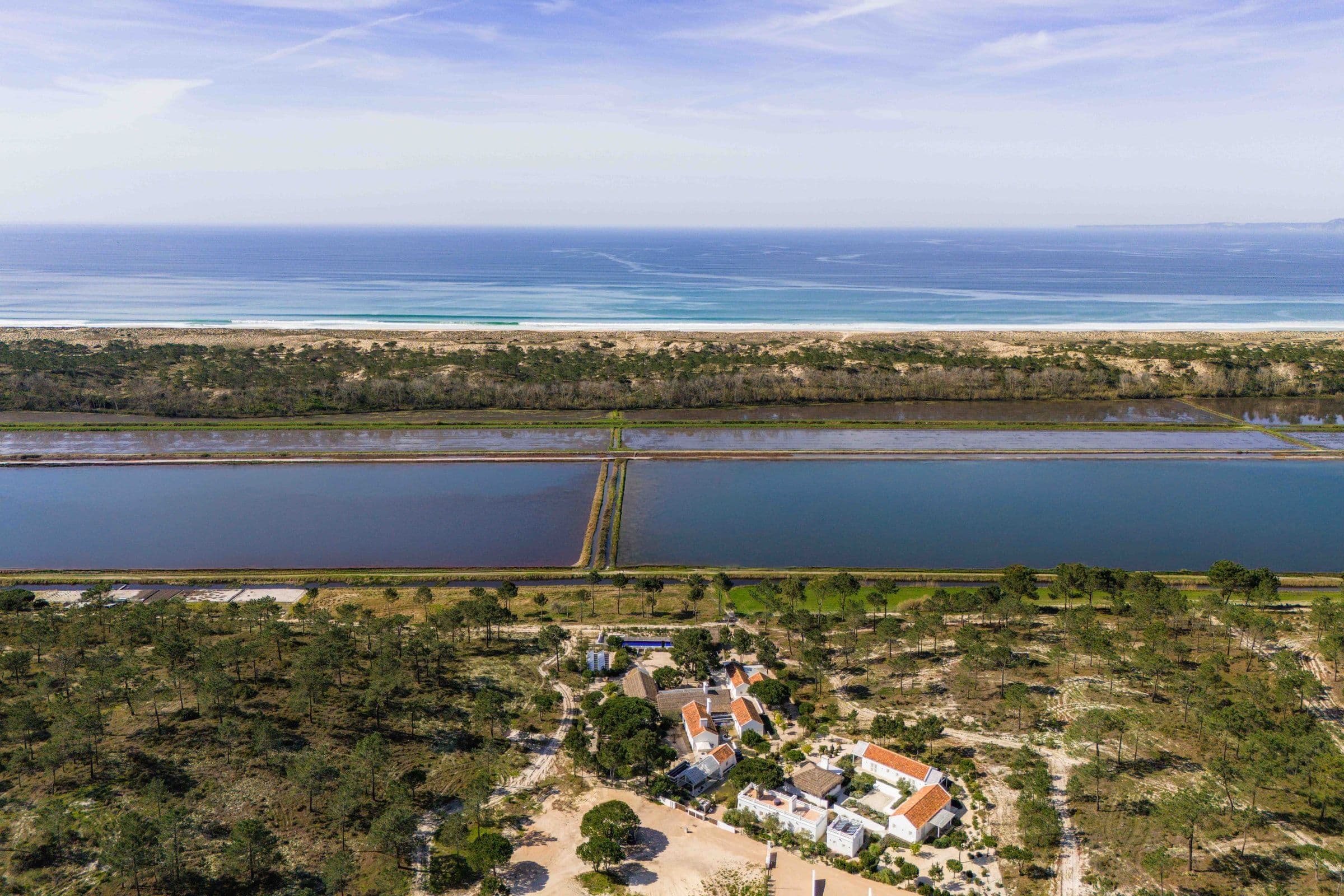 Villa Harmonia da Comporta view across rice fields to Atlantic Ocean, Comporta, Portugal