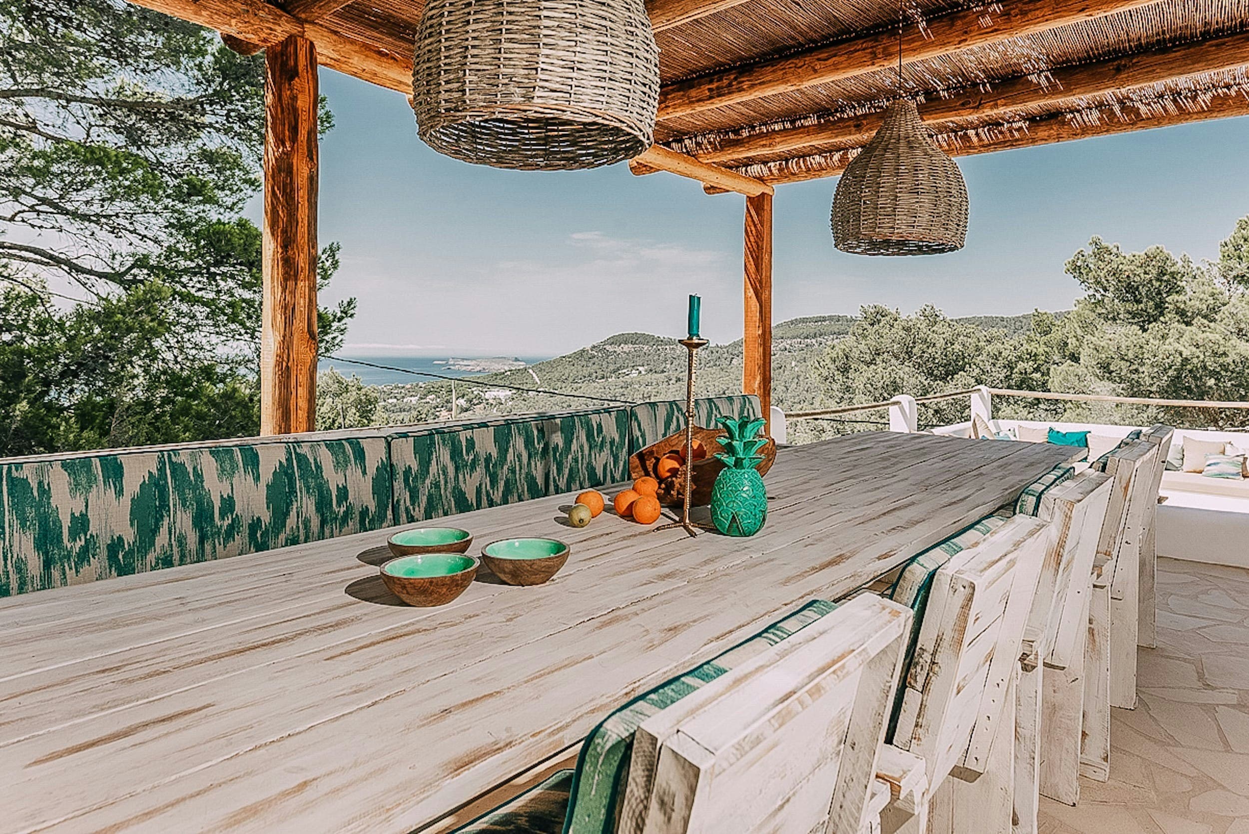 The White Buddha outdoor dining terrace with wicker lights, Sant Josep de sa Talaia, Spain