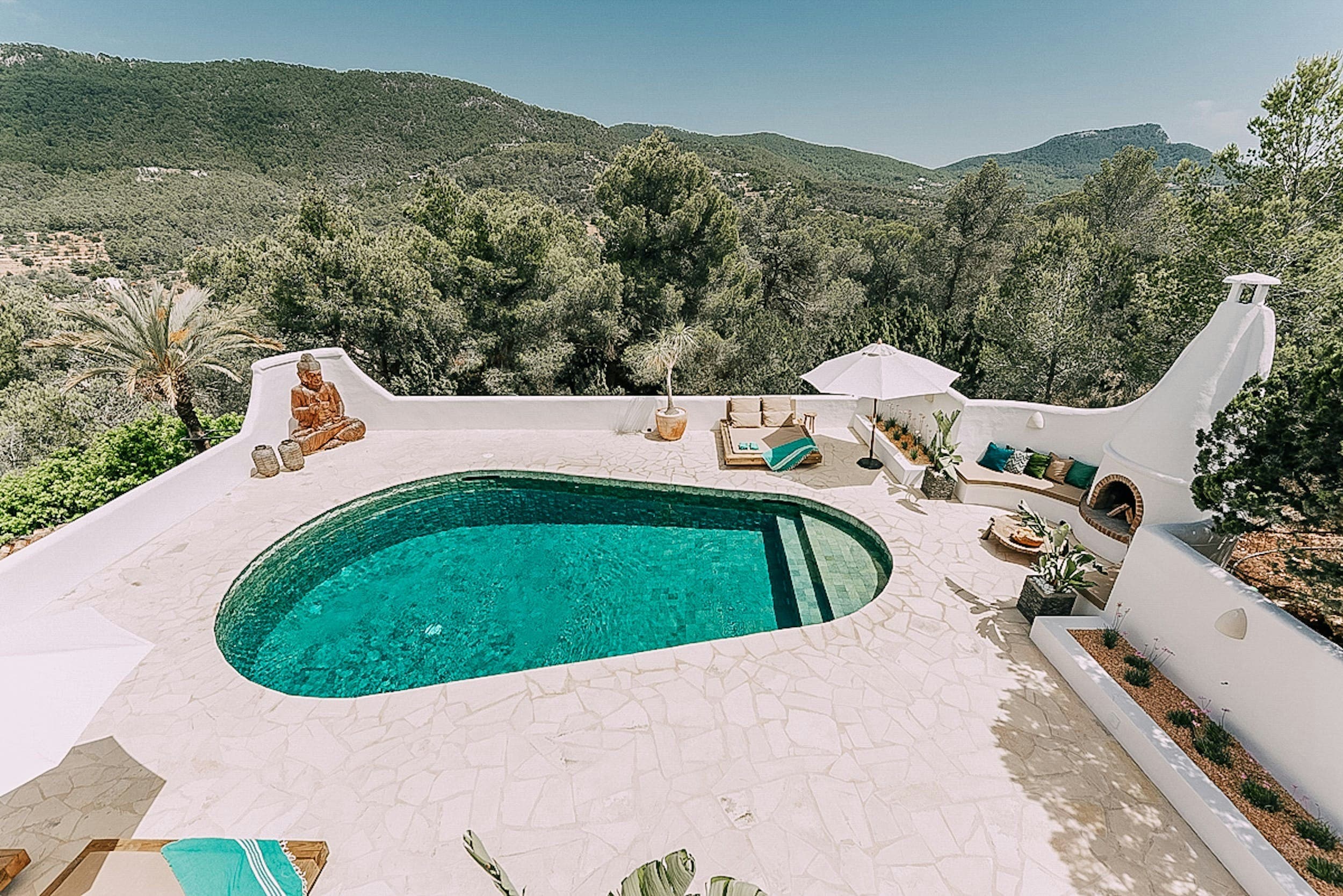 The White Buddha villa pool with organic curves and mountain views, Sant Josep de sa Talaia, Spain