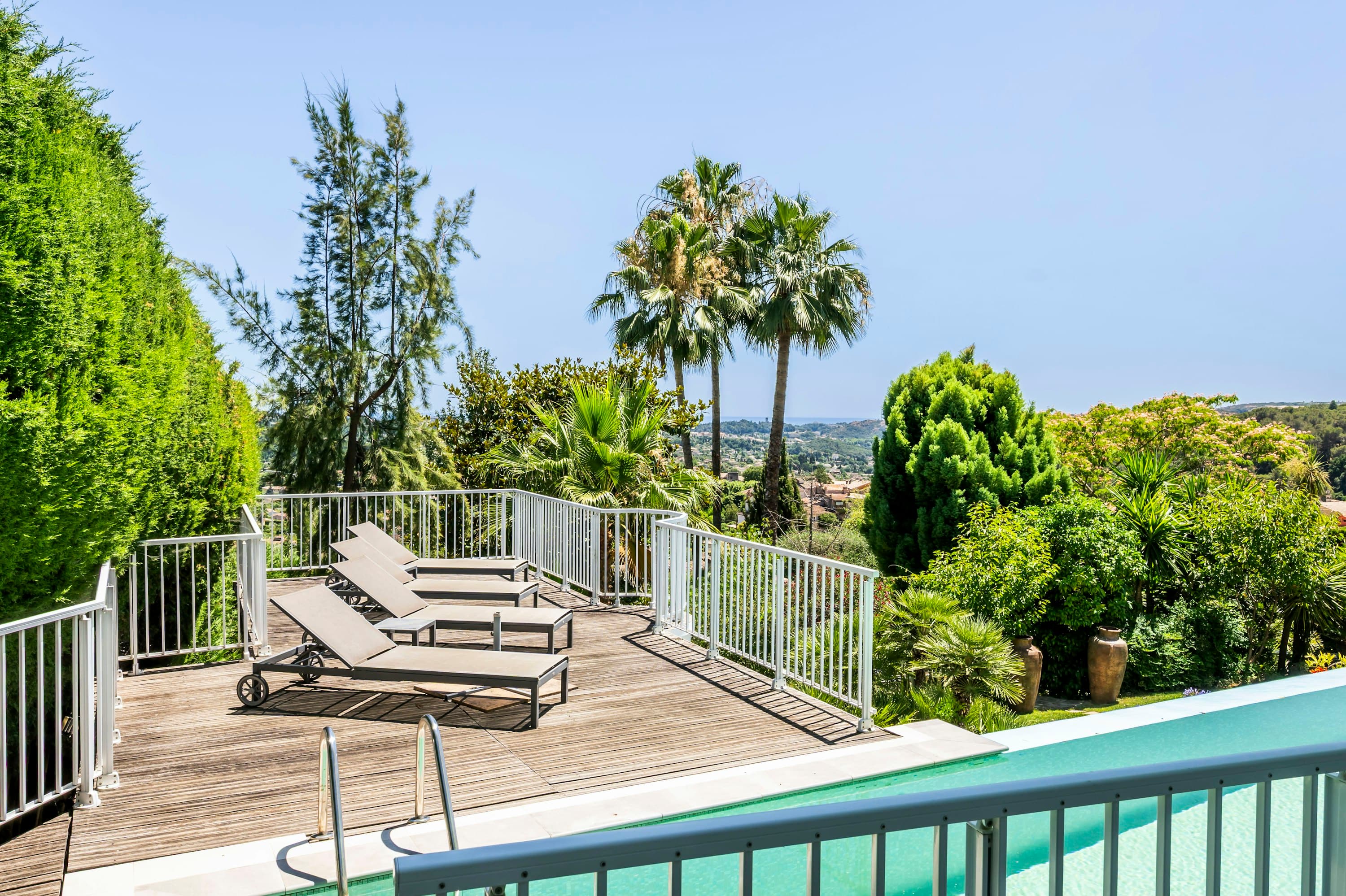 Olive and Sea pool deck terrace with loungers and landscape views, La Colle-sur-Loup, France