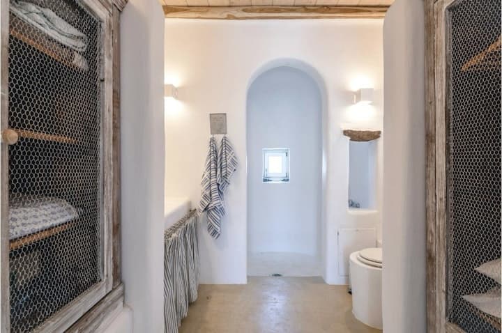 Stratos Views ensuite bathroom with Cycladic arched doorway, Mykonos, Greece