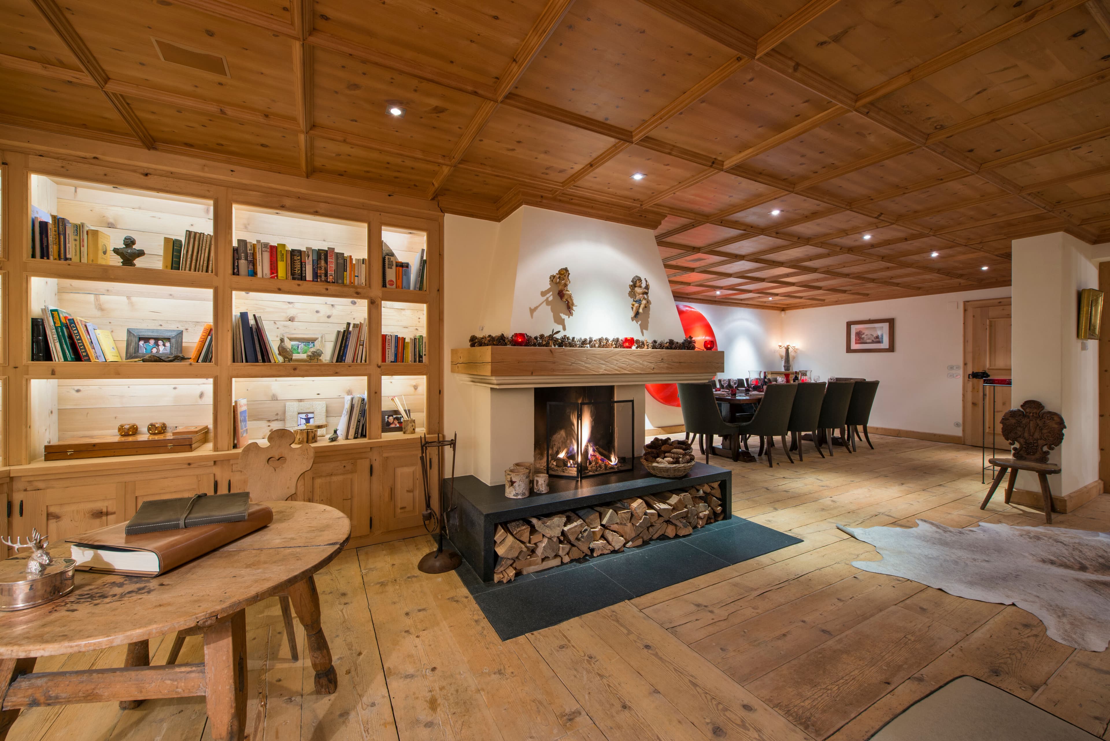 Chalet Maria Schnee formal dining room with library and fireplace, Sankt Anton, Austria