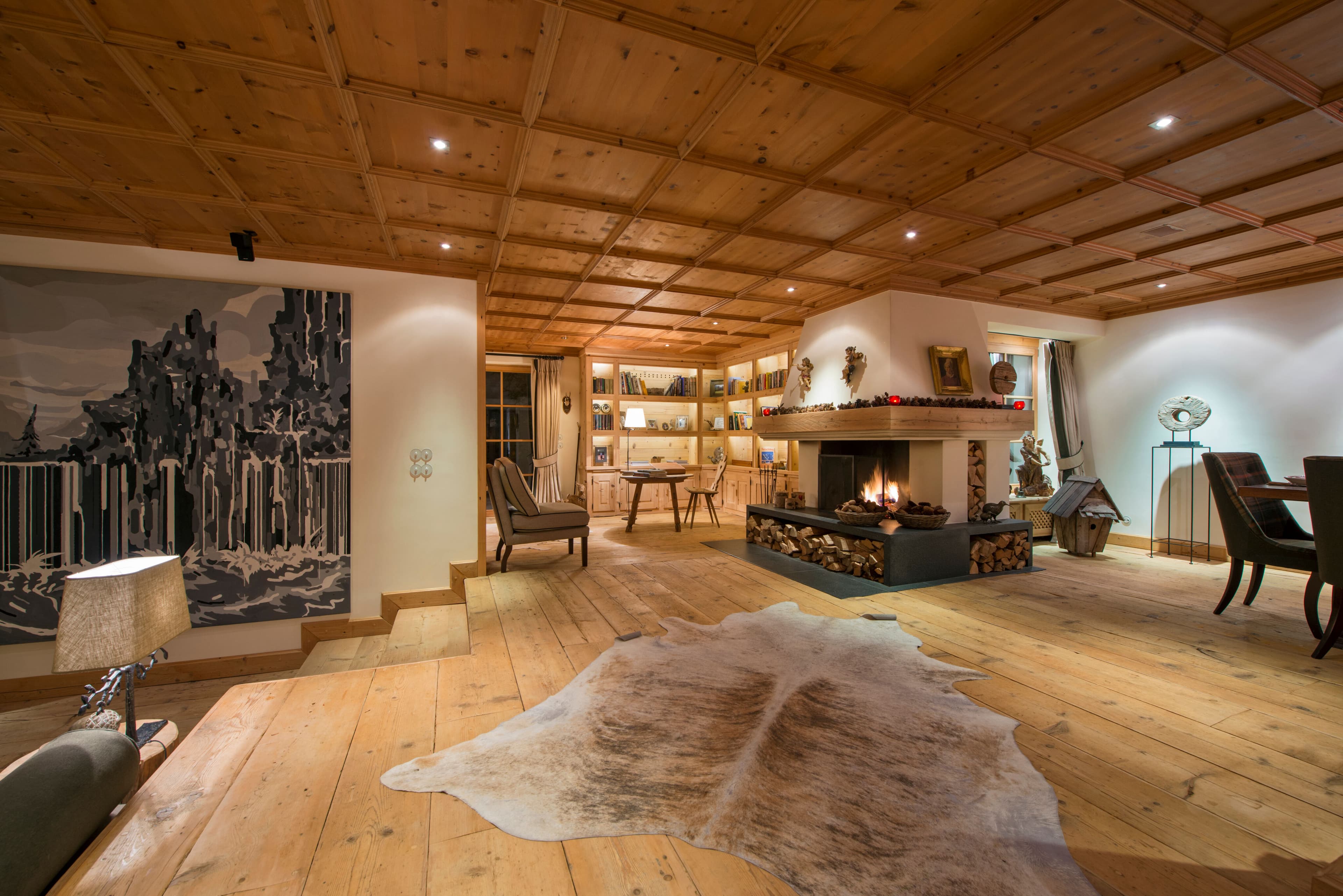 Chalet Maria Schnee fireside seating area with bookshelves, Sankt Anton, Austrian Alps