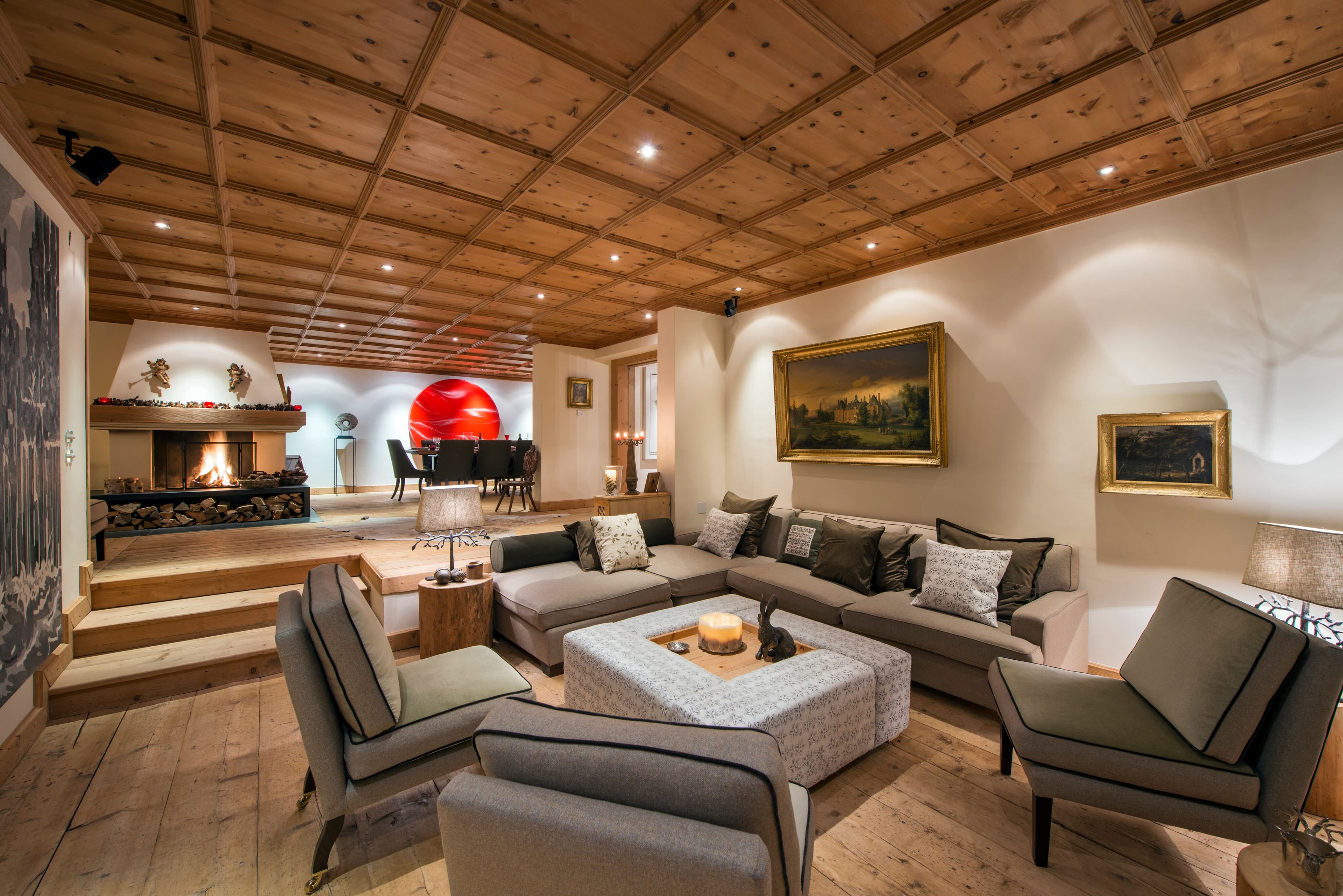 Chalet Maria Schnee living room with coffered ceiling and fireplace, Sankt Anton, Austria