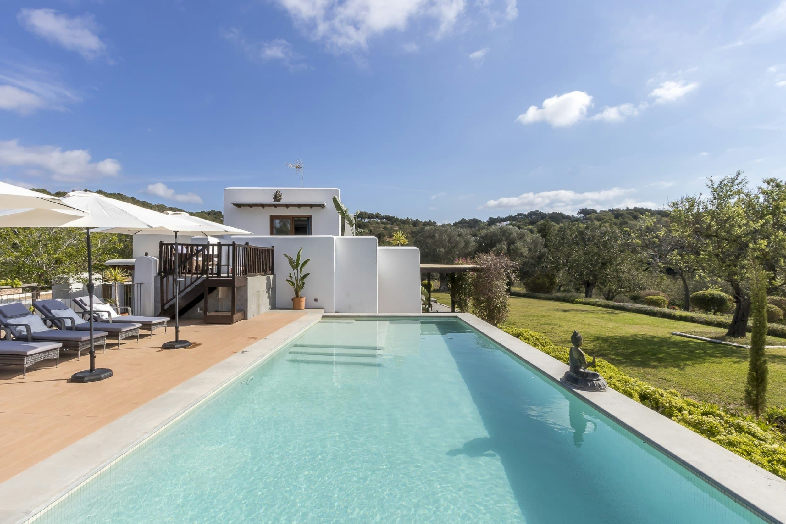 Celestial Blue villa exterior with infinity pool overlooking olive groves, Santa Eulària des Riu, Spain