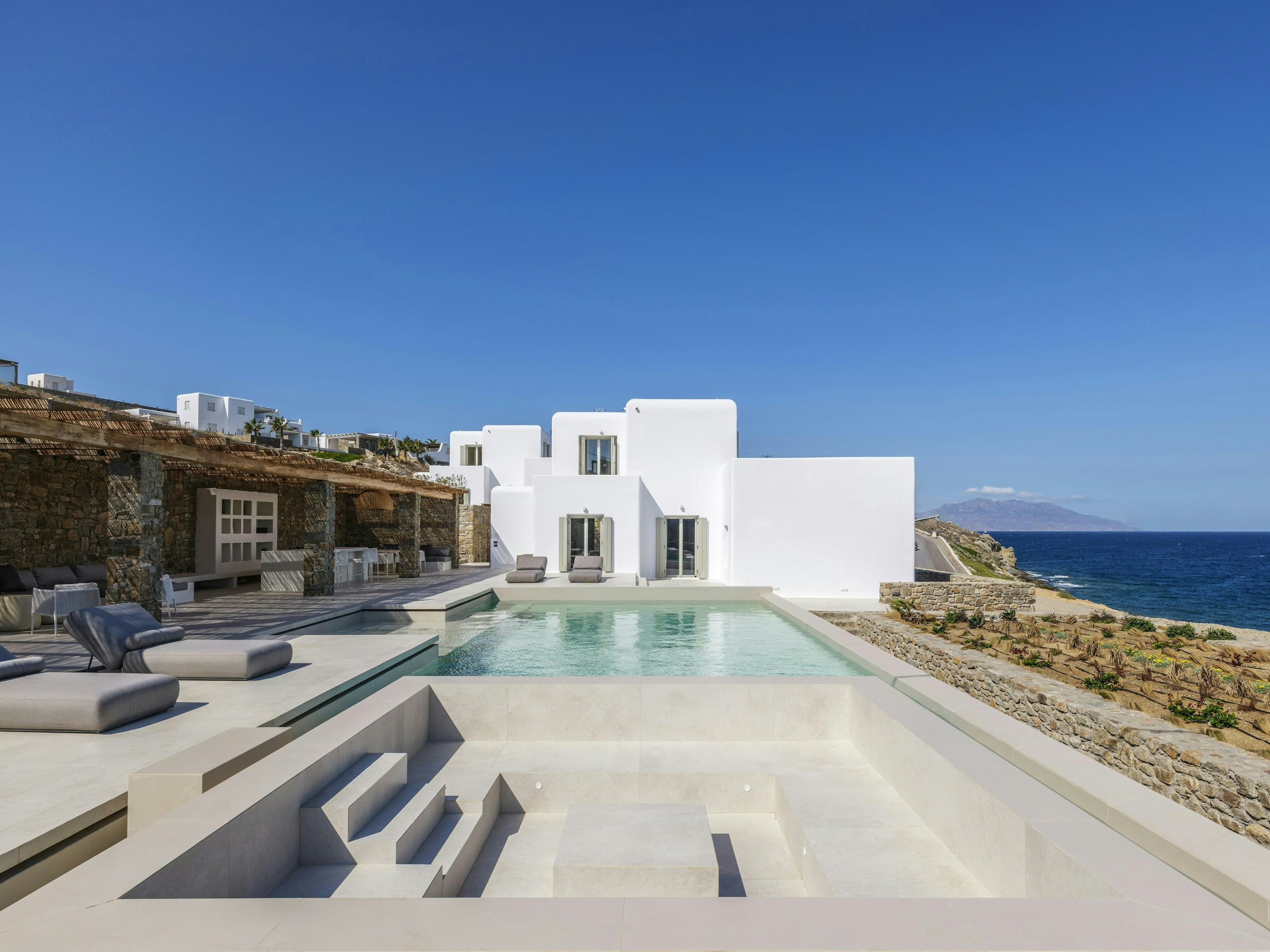 The Moon Muse infinity pool and pergola terrace overlooking the Aegean Sea, Agios Ioannis, Greece
