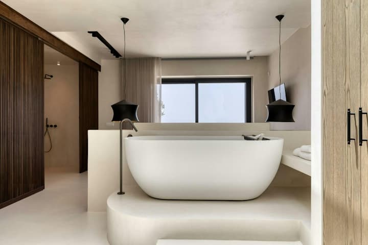 Heavenly Joy villa master ensuite bathroom with freestanding tub and sea views, Mykonos, Greece
