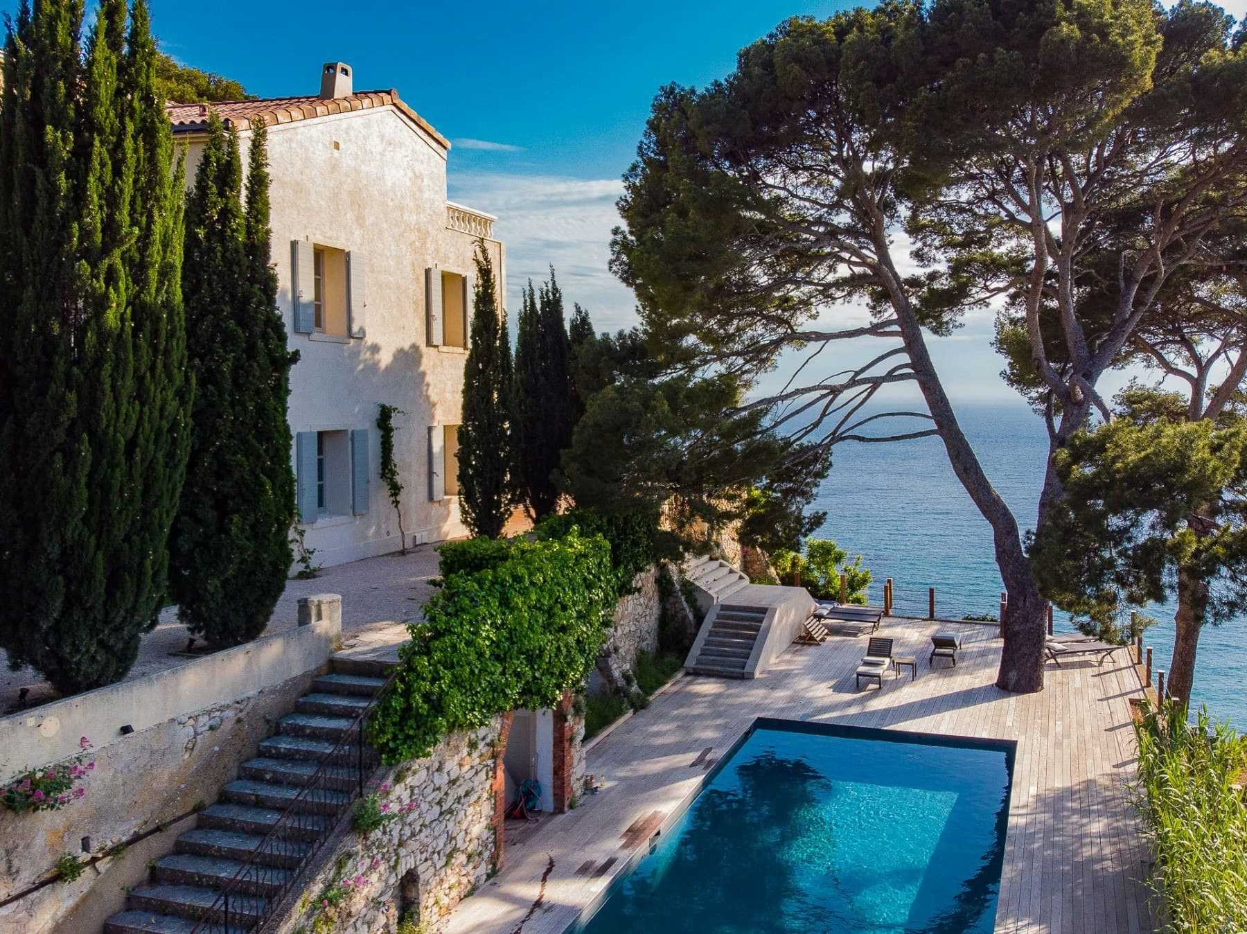 Be Our Guest villa exterior with swimming pool on timber deck and coastal views, Cassis, France