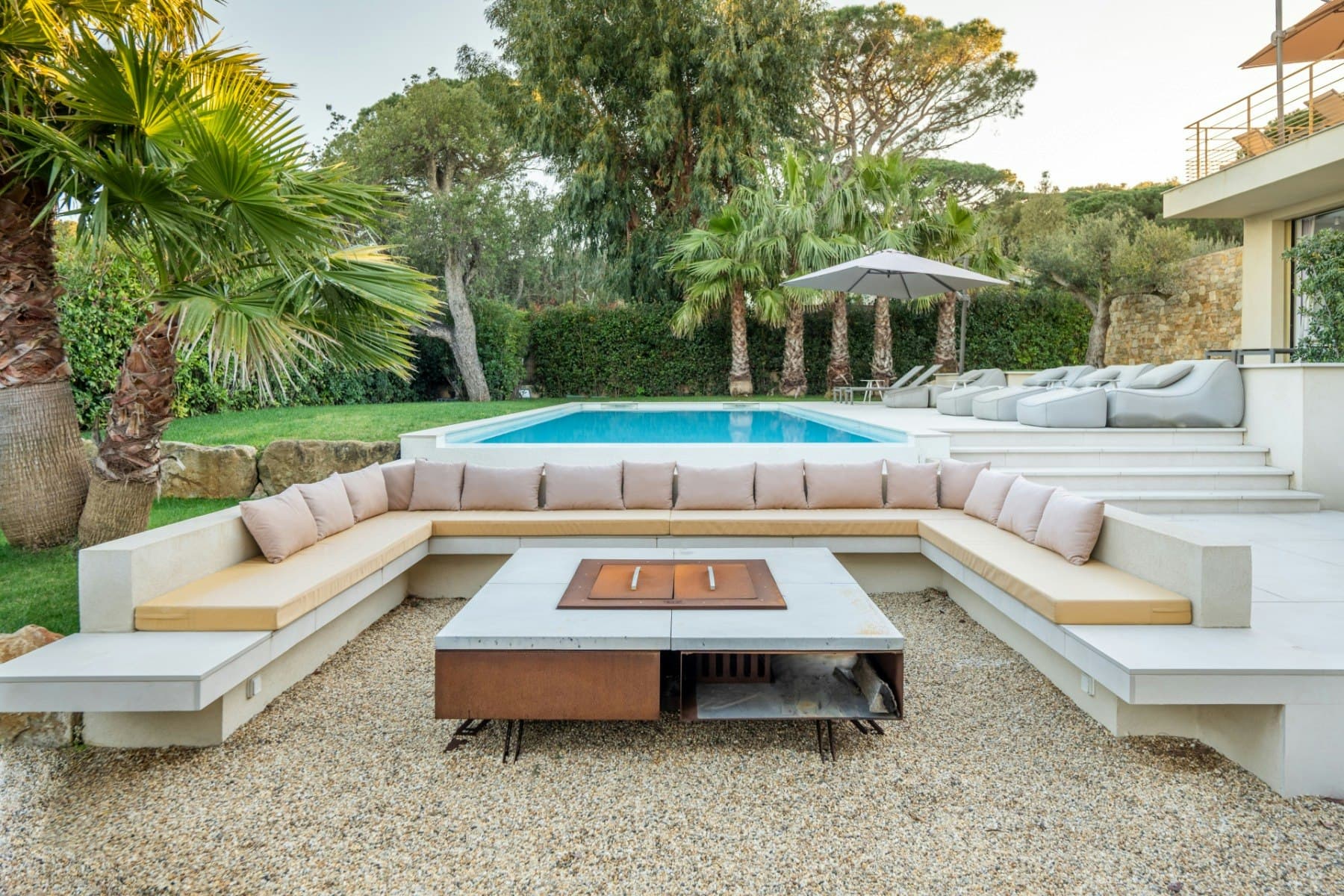 Sea Blue Bliss sunken terrace lounge with pool and palm trees, Saint-Tropez, French Riviera, France