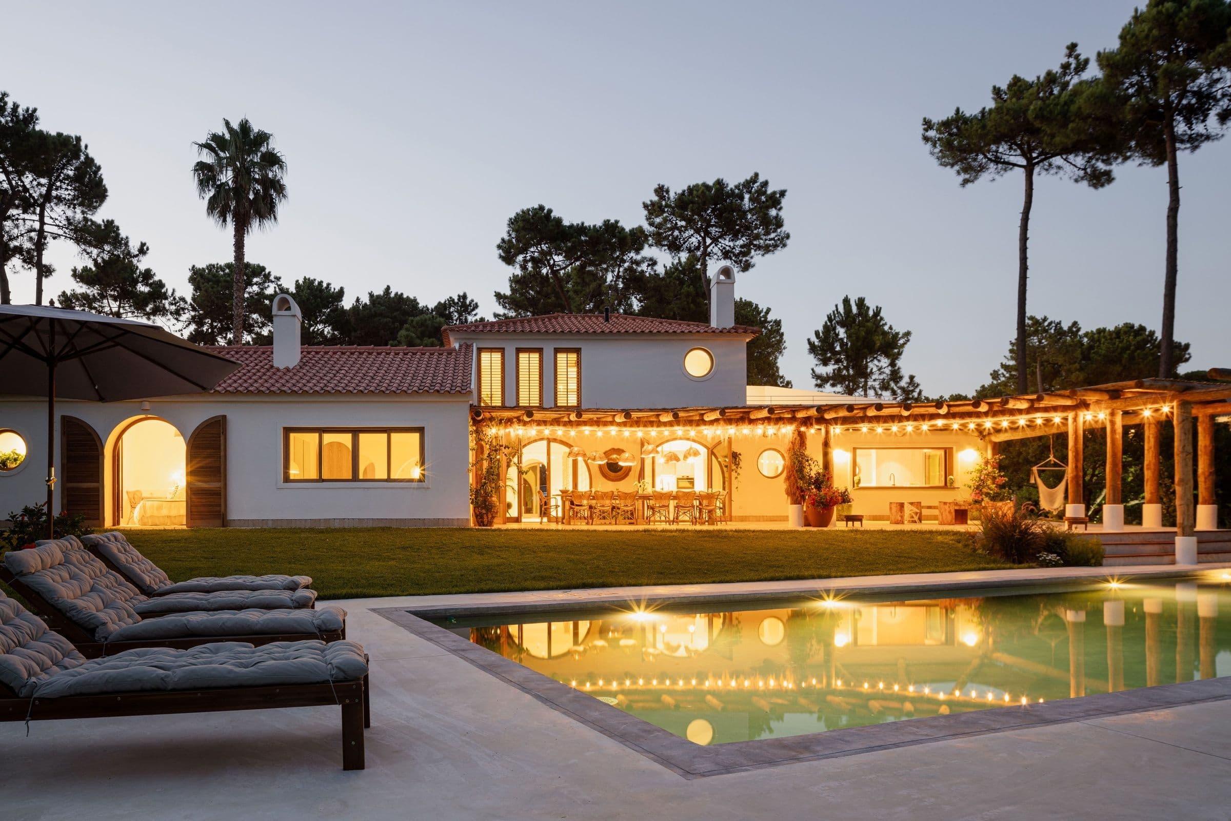 Villa Caparica exterior with arched windows and pool, Costa da Caparica, Portugal