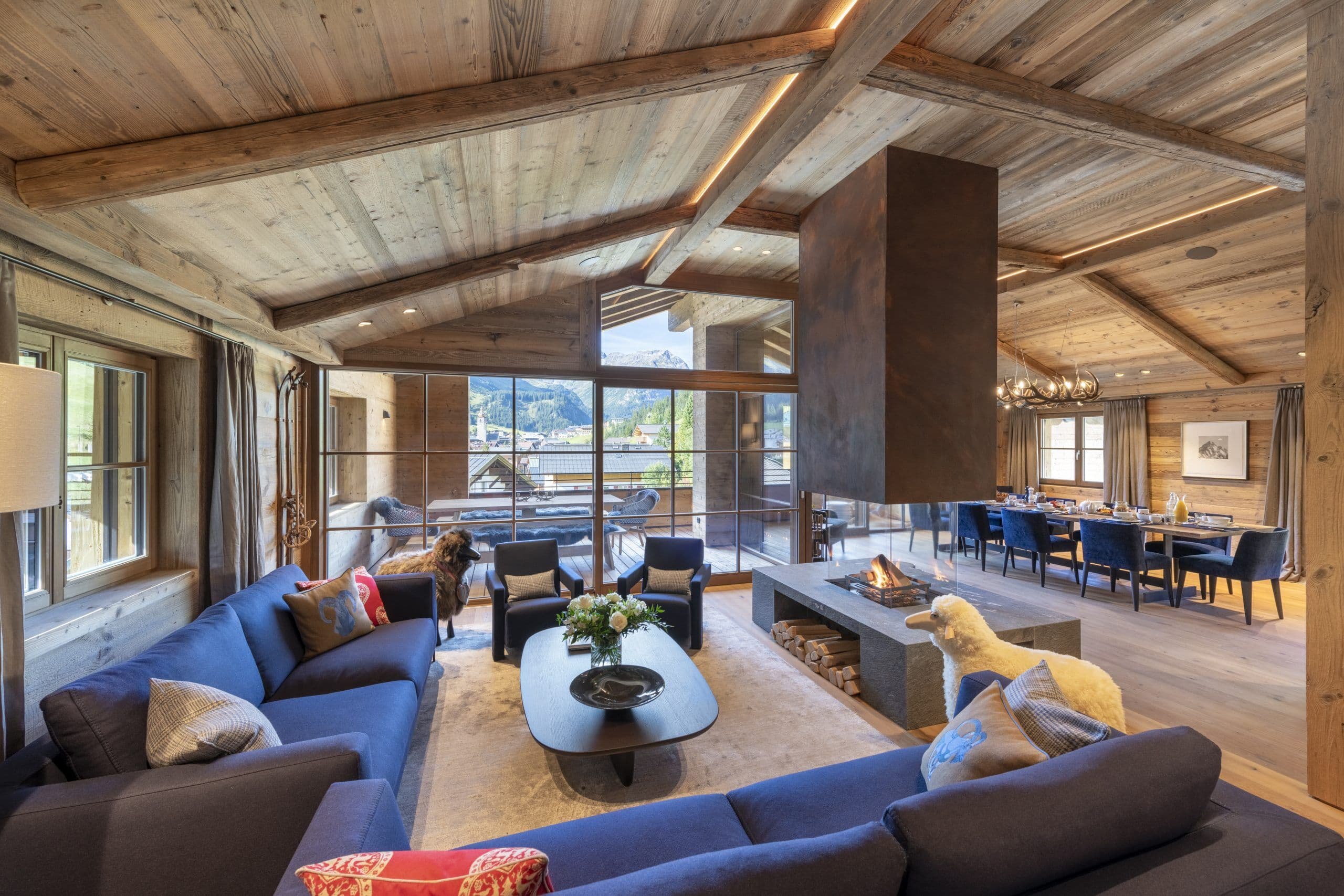 Chalech S contemporary living room with mountain views through floor-to-ceiling windows, Lech, Austria