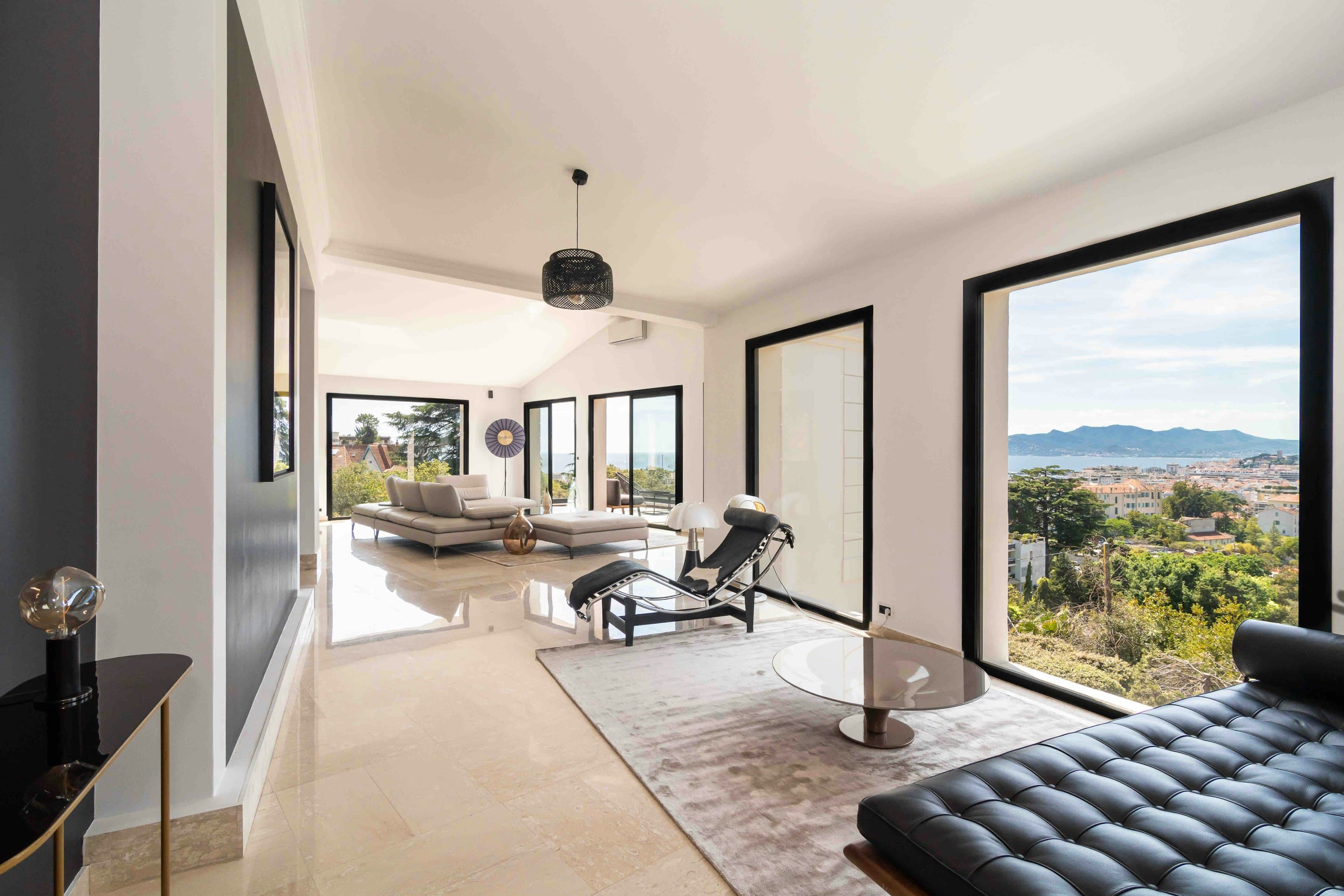 The Rosewood living room with marble floors and coastal views, Cannes, French Riviera, France