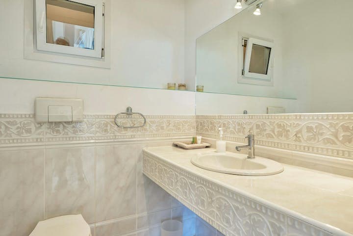 The Eyes of Benirras guest bathroom with decorative tiles, Sant Joan de Labritja, Balearic Islands