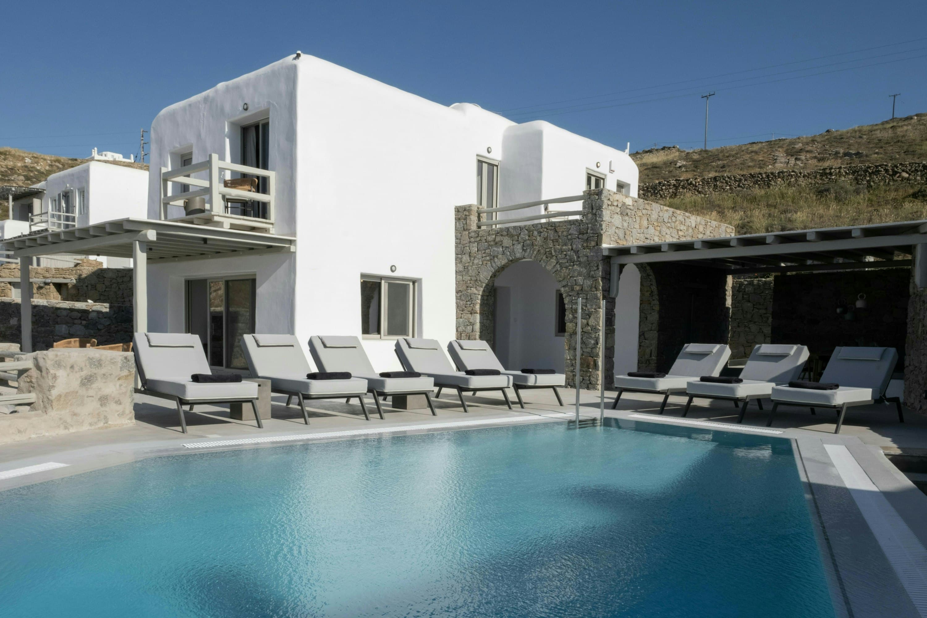 Island Azure Haven white Cycladic villa exterior with pool terrace, Mykonos, Greece
