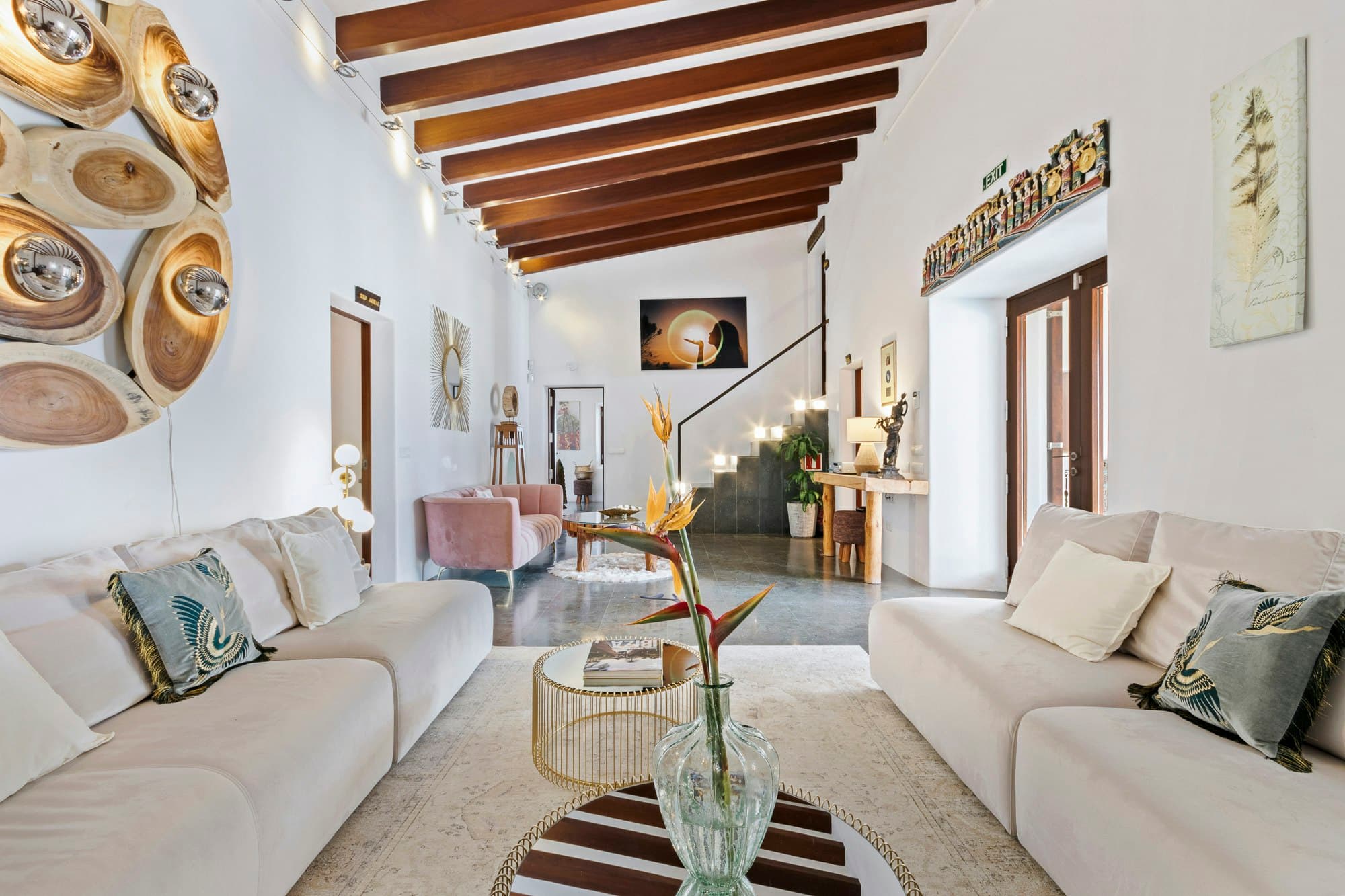 Ode to Balearic Sunsets living room with timber beams, Santa Eulària des Riu, Spain